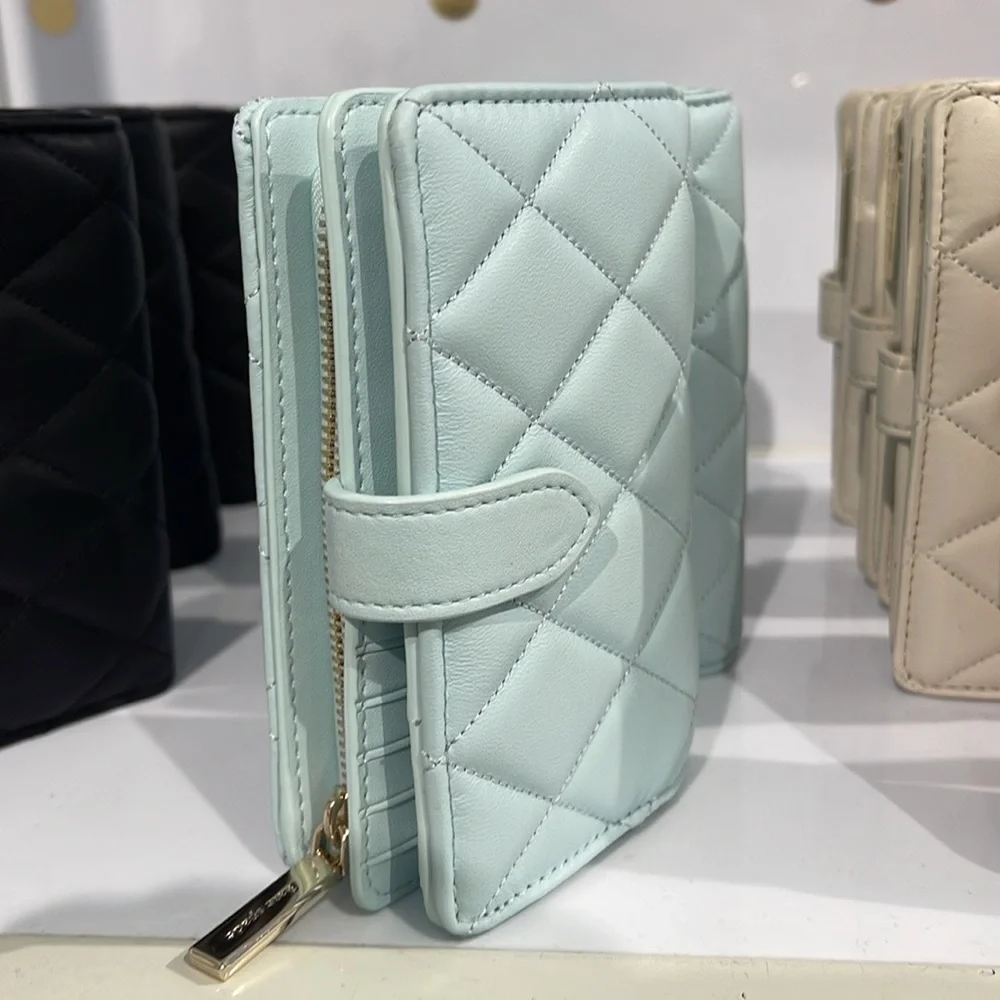 Kate Spade Carey Medium Compartment Bifold Wallet 
COLOR: Turquoise - Picture 13 of 16